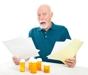 Confused man with pill bottles
